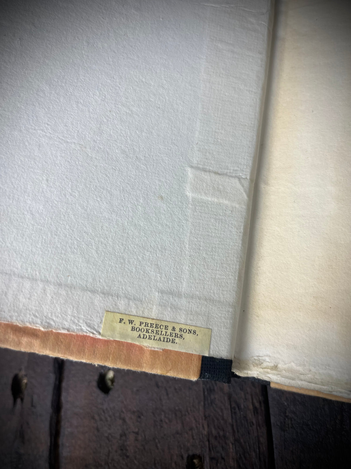 F. W. Preece & Sons, Adelaide bookseller label inside Pindar’s Odes of Victory, showing wear near the hinge.