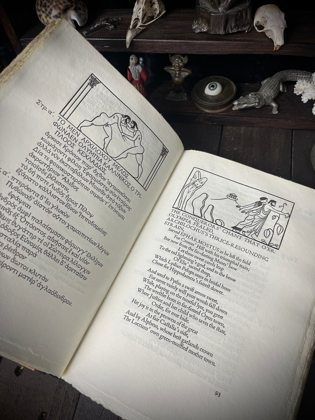 Open pages of Pindar’s Odes of Victory showing Greek text, English verse and John Farleigh wood engravings.