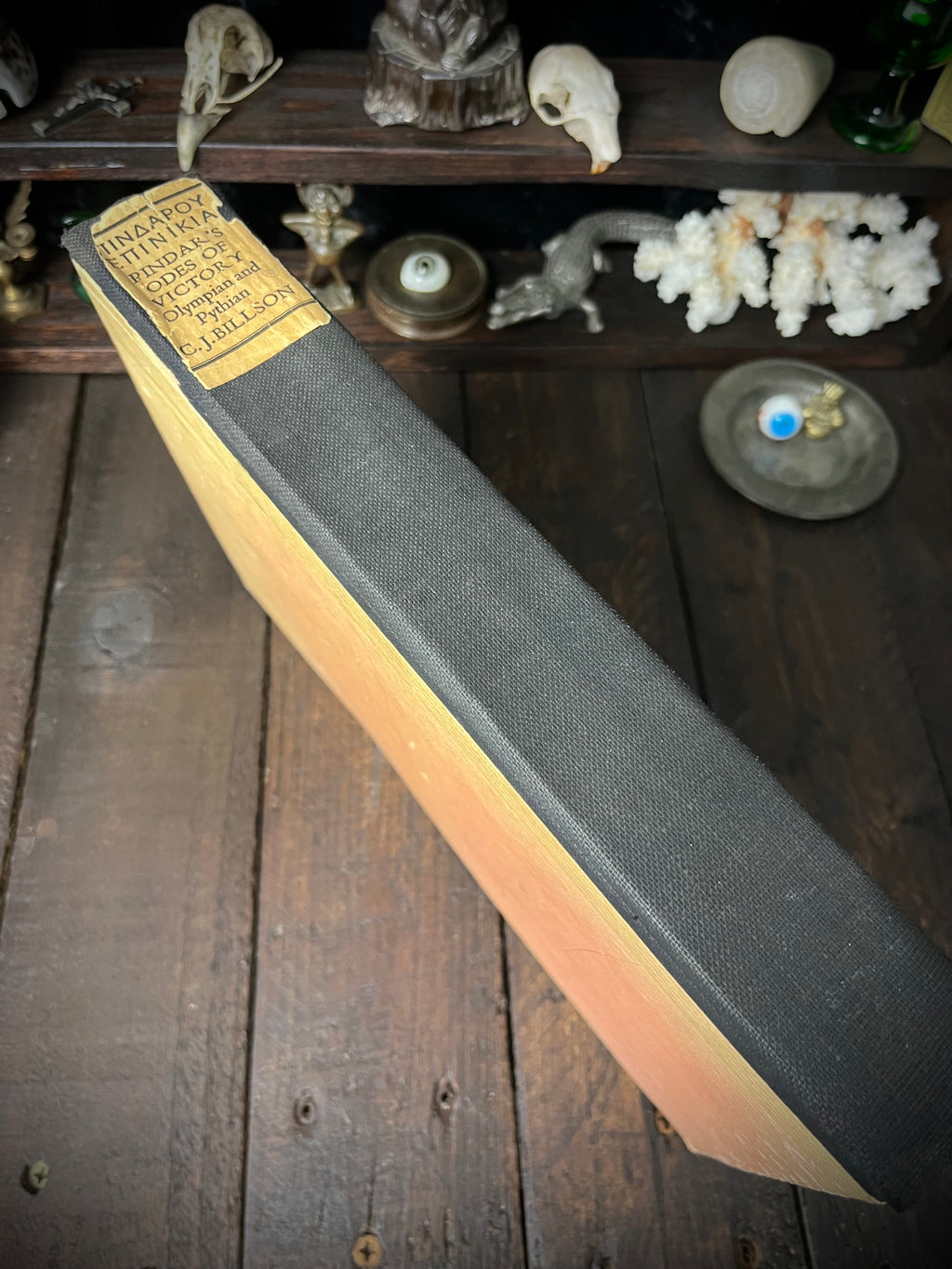 Black cloth spine of Pindar’s Odes of Victory with gold-coloured title label naming C. J. Billson.