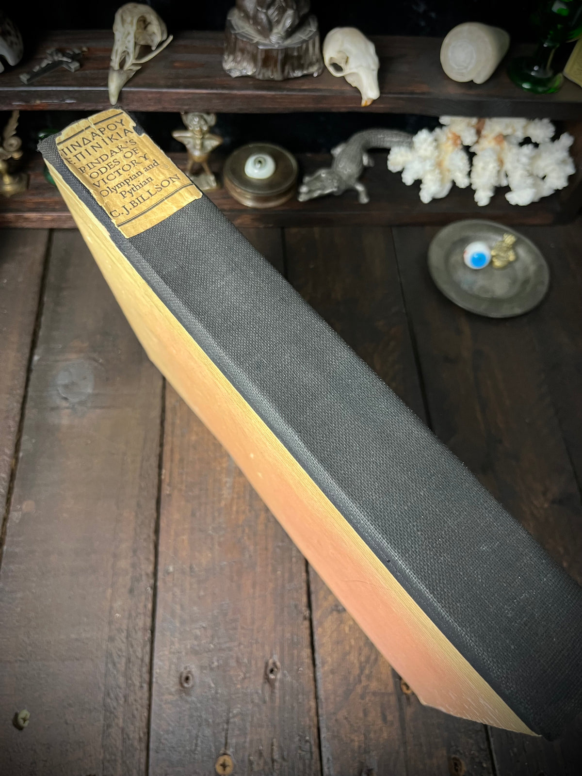 Black cloth spine of Pindar’s Odes of Victory with gold-coloured title label naming C. J. Billson.